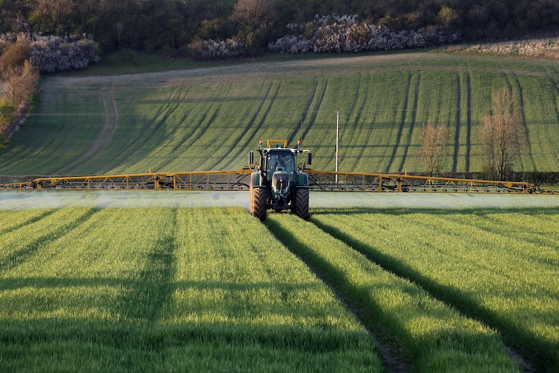 Agriculture – Farmer Spraying Crops