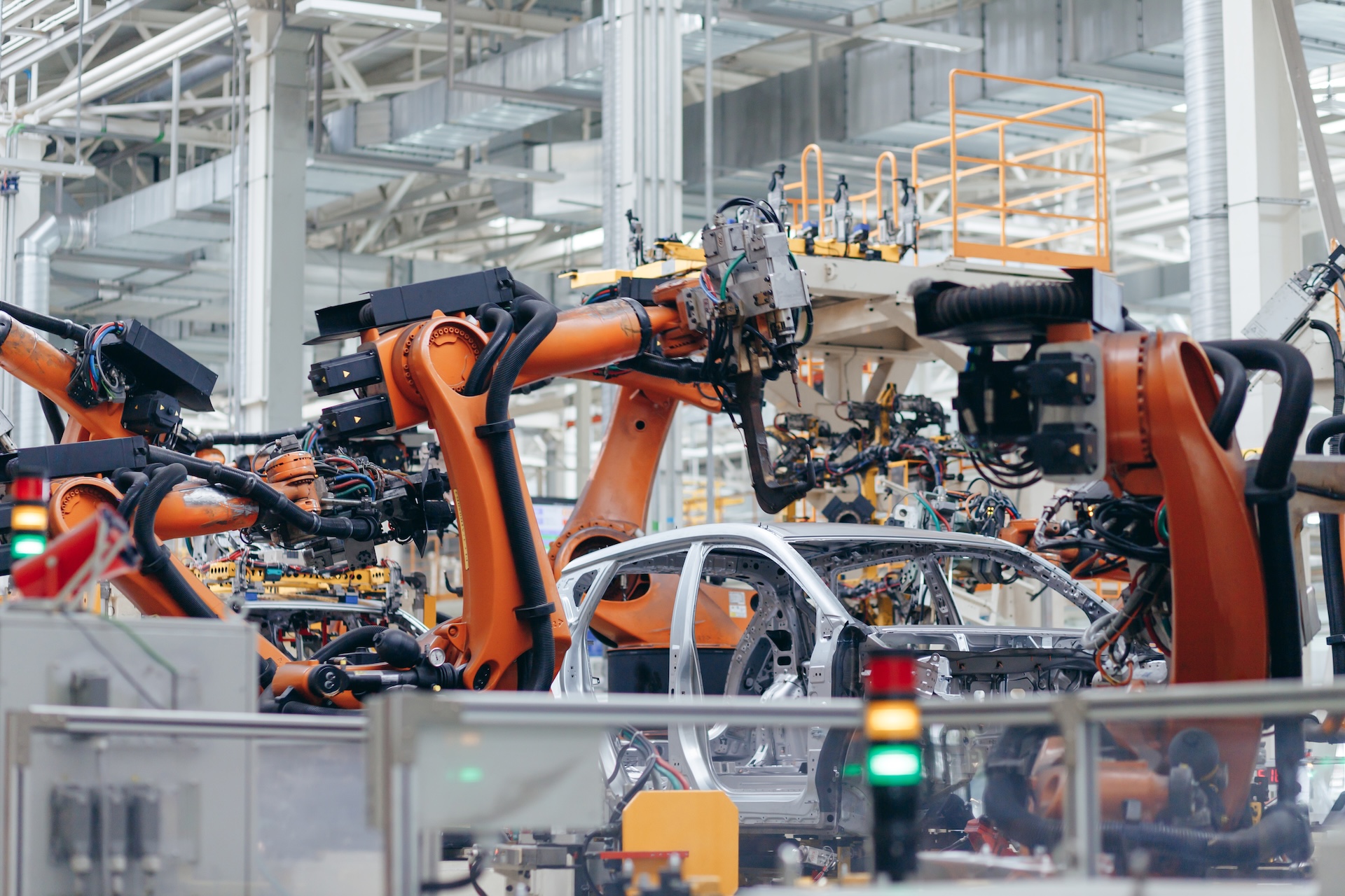Automotive production line. Robotic Welding car body. Modern car Assembly plant