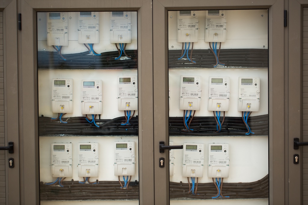 Smart domestic electricity meter isolated on white with clipping path.